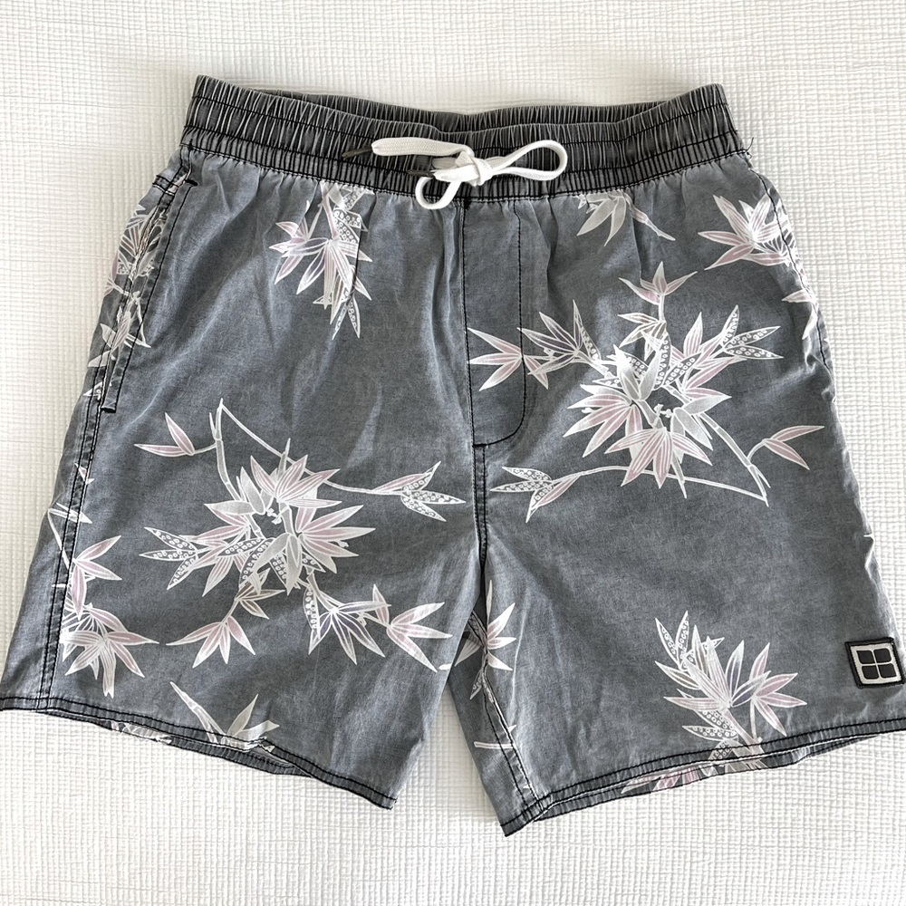 Insight Men’s Men’s tropical distressed print swim trunks.